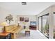 Cozy living room features neutral decor, comfortable seating, and sliding door access to the outside at 3914 Glen Oaks Manor Dr, Sarasota, FL 34232