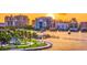 Scenic waterfront view featuring a park, marina, and city skyline at sunset creating a vibrant and picturesque scene at 3914 Glen Oaks Manor Dr, Sarasota, FL 34232