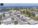 Aerial view of waterfront community, the subject property featuring tropical landscaping and a carport at 407 63Rd St, Holmes Beach, FL 34217