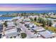 Aerial view of waterfront community near the Skyway Bridge featuring tropical landscaping and access to Tampa Bay at 407 63Rd St, Holmes Beach, FL 34217