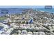 Stunning aerial view of a waterfront community with canal access and Gulf of Mexico views at 407 63Rd St, Holmes Beach, FL 34217
