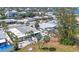 Aerial view of home with solar panels, swimming pool and well maintained yard at 407 63Rd St, Holmes Beach, FL 34217