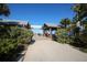 Entrance to Anna Maria City Pier with covered walkways and lush landscaping at 407 63Rd St, Holmes Beach, FL 34217