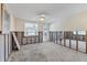 Partially renovated living room features bright windows and a ceiling fan fixture at 407 63Rd St, Holmes Beach, FL 34217