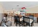 Spacious living area reveals barstool seating and ceiling fan, with renovation debris at 407 63Rd St, Holmes Beach, FL 34217