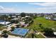 Aerial view of a community park featuring pickleball courts, a playground, and a baseball field at 407 63Rd St, Holmes Beach, FL 34217