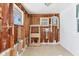 Partially renovated sun room features exposed wood studs and tiled flooring at 407 63Rd St, Holmes Beach, FL 34217