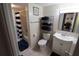 Functional bathroom featuring a shower-tub combo, toilet, and vanity with adequate storage at 4154 Heron Way # 203B, Bradenton, FL 34205