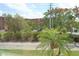 Scenic view of lush landscaping and well-maintained surroundings within the community at 4154 Heron Way # 203B, Bradenton, FL 34205