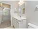 Bathroom with a modern vanity and a view into the carpeted bedroom at 4220 Via Piedra Cir # 4-101, Sarasota, FL 34233