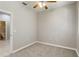 Bright bedroom with modern ceiling fan and carpet, adjacent to a bathroom, for convenience at 4220 Via Piedra Cir # 4-101, Sarasota, FL 34233