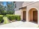 Cozy townhome entrance with a well-maintained walkway and lush greenery at 4220 Via Piedra Cir # 4-101, Sarasota, FL 34233