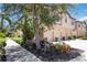 Charming townhome with lush landscaping, trees, and well-kept lawn at 4220 Via Piedra Cir # 4-101, Sarasota, FL 34233