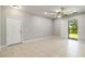 Spacious living room with neutral walls, tile floors, and a ceiling fan at 4220 Via Piedra Cir # 4-101, Sarasota, FL 34233