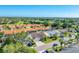 Scenic aerial shot of a residential community featuring well-maintained homes, lush landscaping, and mature trees at 4585 Dover Street E Cir, Bradenton, FL 34203