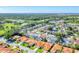 Serene aerial view of a residential area featuring a pond, green spaces, and neatly arranged homes at 4585 Dover Street E Cir, Bradenton, FL 34203