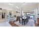 Elegant dining area with hardwood floors, decorative accents, and a seamless transition to the outdoor area at 4585 Dover Street E Cir, Bradenton, FL 34203
