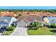 Charming single-story home with a well-maintained lawn, mature landscaping, and an attached two-car garage at 4585 Dover Street E Cir, Bradenton, FL 34203