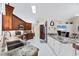 Modern kitchen with stainless steel appliances, granite countertops, and ample cabinet space at 4585 Dover Street E Cir, Bradenton, FL 34203