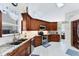 Well-appointed kitchen with granite countertops, tile backsplash, and a full suite of stainless steel appliances at 4585 Dover Street E Cir, Bradenton, FL 34203