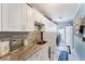 Laundry room features a washer and dryer, ample cabinet storage and a stylish countertop at 4585 Dover Street E Cir, Bradenton, FL 34203