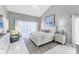 Comfortable main bedroom features a large window with sheer curtains and neutral décor at 4585 Dover Street E Cir, Bradenton, FL 34203