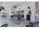 Covered patio with tiled floor, ceiling fans, outdoor furniture, and mini fridge at 4585 Dover Street E Cir, Bradenton, FL 34203