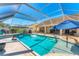 Sparkling pool with screened enclosure, poolside seating, and lush landscaping at 4585 Dover Street E Cir, Bradenton, FL 34203