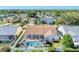 The rear exterior view features a private screened-in pool and lush landscaping, perfect for outdoor relaxation at 4585 Dover Street E Cir, Bradenton, FL 34203