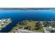 Waterfront homes and lot for sale featuring a large park and canal access for boating at 5365 Craig Ter, Port Charlotte, FL 33981