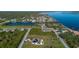Property features a home with screened pool, adjacent vacant lot, and convenient access to the waterfront at 5365 Craig Ter, Port Charlotte, FL 33981
