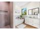 Contemporary bathroom boasting a soaking tub, walk-in shower, and marble countertop with decor at 5365 Craig Ter, Port Charlotte, FL 33981