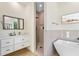 Bathroom with modern vanity, soaking tub, and walk-in shower at 5365 Craig Ter, Port Charlotte, FL 33981