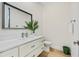 Bright bathroom features a modern vanity and a toilet at 5365 Craig Ter, Port Charlotte, FL 33981