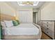 Bedroom featuring hard wood floors, a ceiling fan, and dresser at 5365 Craig Ter, Port Charlotte, FL 33981