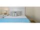 Cozy bedroom with a bed featuring blue accents and decorative pillows at 5365 Craig Ter, Port Charlotte, FL 33981