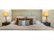 Bedroom featuring a decorative headboard, bedside lamps, and a comfortable bed at 5365 Craig Ter, Port Charlotte, FL 33981