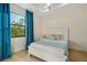 Bright bedroom features a window with a view of the trees at 5365 Craig Ter, Port Charlotte, FL 33981