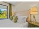 Comfortable bedroom features a decorative lamp, pillows, and white bedding at 5365 Craig Ter, Port Charlotte, FL 33981
