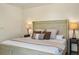 Cozy bedroom featuring a decorative headboard, bedside lamps, and a comfortable bed at 5365 Craig Ter, Port Charlotte, FL 33981