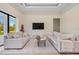 Bright living room with recessed lighting, two sofas, and large windows with outdoor view at 5365 Craig Ter, Port Charlotte, FL 33981