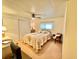Comfortable bedroom with a double bed, accent chair, and floral bedding at 5511 Denmark Dr, Bradenton, FL 34207