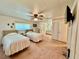 Bright and spacious bedroom with two beds and a connected bathroom providing convenience and privacy at 5511 Denmark Dr, Bradenton, FL 34207