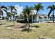 Attractive home with well-manicured lawn and lush landscaping with mature palm trees in a desirable location at 5511 Denmark Dr, Bradenton, FL 34207