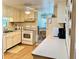 Efficient kitchen with ample counter space and white appliances adjacent to the dining area at 5511 Denmark Dr, Bradenton, FL 34207