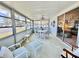 Bright sunroom with ample seating, a dining table, and lots of natural light at 5511 Denmark Dr, Bradenton, FL 34207