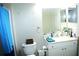 Bathroom area featuring a toilet, countertop and shower at 5681 Bidwell Pkwy # 104, Sarasota, FL 34233