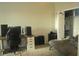 This bedroom features a desk with computer monitors, a bed, and a closet at 5681 Bidwell Pkwy # 104, Sarasota, FL 34233