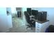 This bedroom features a desk and computer monitors at 5681 Bidwell Pkwy # 104, Sarasota, FL 34233