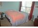 Comfortable bedroom featuring natural light and a cozy atmosphere at 5681 Bidwell Pkwy # 104, Sarasota, FL 34233